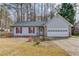 Charming single-story home featuring stone accents, red shutters, and a two-car garage at 629 Granite Ln, Loganville, GA 30052