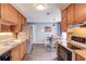 Kitchen with stainless steel appliances, wood cabinets, and hardwood floors at 629 Granite Ln, Loganville, GA 30052