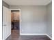 Empty room leading to laundry room with washer and dryer at 629 Granite Ln, Loganville, GA 30052