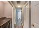 Hallway shot to the laundry area showing new washer/dryer and hardwood flooring at 629 Granite Ln, Loganville, GA 30052