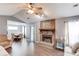 Cozy living room with a stone fireplace, hardwood floors, and natural light at 629 Granite Ln, Loganville, GA 30052