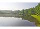 Scenic lake view reflecting the sky and surrounding trees at 783 Lost Creek Cir, Stone Mountain, GA 30088