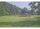 A verdant community park offers a covered pavilion with picnic tables and playground equipment at 783 Lost Creek Cir, Stone Mountain, GA 30088