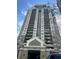 A full exterior view of the Park Towers building with many levels of balconies at 795 Hammond Dr # 1904, Atlanta, GA 30328