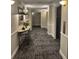 Hallway featuring patterned carpet, modern lighting, and an elevator bank at 795 Hammond Dr # 1904, Atlanta, GA 30328