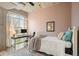 Stylish bedroom with concrete ceilings, calming paint colors, and a well-lit workspace at 890 Memorial Se Dr # 102, Atlanta, GA 30316