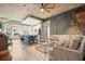 Open-concept living room with modern furnishings, a kitchen island and an exposed concrete ceiling at 890 Memorial Se Dr # 102, Atlanta, GA 30316