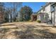 Large backyard with lush greenery and a screened porch, providing a serene and private outdoor retreat at 1005 W Kingston Dr, Atlanta, GA 30342