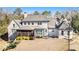 Aerial view of the backyard featuring a brick home and a screened porch, great for entertaining at 1005 W Kingston Dr, Atlanta, GA 30342