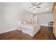 Comfortable bedroom with patterned comforter and hardwood floors at 1005 W Kingston Dr, Atlanta, GA 30342