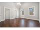 Spacious bedroom offering hardwood floors, crown molding, and many windows at 1005 W Kingston Dr, Atlanta, GA 30342