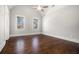 Bedroom with wood floors, neutral walls, and many windows at 1005 W Kingston Dr, Atlanta, GA 30342