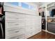 Large walk-in closet with custom cabinetry and drawers at 1005 W Kingston Dr, Atlanta, GA 30342