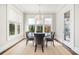 Elegant dining area featuring a round table, stylish chairs, and natural light at 1005 W Kingston Dr, Atlanta, GA 30342