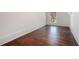 Small empty room with hardwood floors and one window at 1005 W Kingston Dr, Atlanta, GA 30342