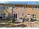 Townhome backyard with a patio and lots of space for relaxing and entertaining at 1914 Lakeshore Overlook Nw Cir, Kennesaw, GA 30152