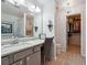 Bathroom features a large mirror, chandelier and a walk-in closet at 1914 Lakeshore Overlook Nw Cir, Kennesaw, GA 30152