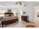 Comfortable bedroom features a ceiling fan, neutral carpet, and warm, inviting decor at 1914 Lakeshore Overlook Nw Cir, Kennesaw, GA 30152