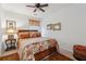 Cozy bedroom with floral bedding, decorative pillows, dark wood furniture, and area rug at 1914 Lakeshore Overlook Nw Cir, Kennesaw, GA 30152