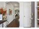 Welcoming entryway with dark hardwood floors and an arched opening into the home at 1914 Lakeshore Overlook Nw Cir, Kennesaw, GA 30152