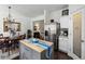 Bright kitchen with stainless steel appliances and open to the dining area at 1914 Lakeshore Overlook Nw Cir, Kennesaw, GA 30152