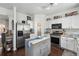 Spacious kitchen with stainless steel appliances, kitchen island, granite counters and white cabinetry at 1914 Lakeshore Overlook Nw Cir, Kennesaw, GA 30152