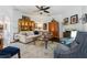 Cozy living room with decorative fireplace, ceiling fan, and neutral furniture at 1914 Lakeshore Overlook Nw Cir, Kennesaw, GA 30152