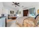 Lovely bedroom with seating area, ceiling fan, and lots of natural light at 1914 Lakeshore Overlook Nw Cir, Kennesaw, GA 30152