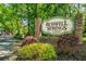 Roswell Springs Condominium Community entrance sign with brick pillars and lush landscaping at 330 Warm Springs Cir, Roswell, GA 30075