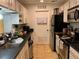 Functional kitchen with white cabinets and dark countertops at 330 Warm Springs Cir, Roswell, GA 30075