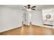 Bright bedroom featuring wood-look flooring, ensuite bathroom, and walk-in closet at 330 Warm Springs Cir, Roswell, GA 30075