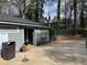 Community pool house with charcoal grill and adjacent pool shown with green safety cover at 330 Warm Springs Cir, Roswell, GA 30075