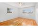 Bright bedroom featuring hardwood floors and ample natural light from two large windows at 1485 Camelot Ln, Tucker, GA 30084