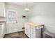 Kitchen area with a butcher block island, a door to the outside, and an overhead light at 1485 Camelot Ln, Tucker, GA 30084