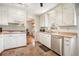 Traditional-style kitchen featuring white cabinets, stainless steel appliances, and a gas stovetop at 1485 Camelot Ln, Tucker, GA 30084