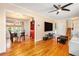 Open living area with hardwood floors flowing into the dining area, creating a spacious feel at 1485 Camelot Ln, Tucker, GA 30084