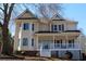 Charming two-story home with gabled roof, bay windows, and inviting front porch at 2031 Lakewood Cir, Grayson, GA 30017