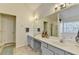 Bright bathroom featuring dual vanity, tiled floors, and a separate tub and shower at 2157 Staunton Dr, Duluth, GA 30096