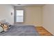 Bedroom featuring a bed, wood floors, and a window providing natural light at 2157 Staunton Dr, Duluth, GA 30096