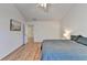 Bright bedroom featuring hardwood floors, a ceiling fan, and a painting on the wall at 2157 Staunton Dr, Duluth, GA 30096