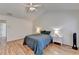 Bright bedroom featuring hardwood floors, a ceiling fan, and vaulted ceilings at 2157 Staunton Dr, Duluth, GA 30096