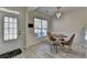 Elegant dining room showcasing a glass table, stylish chairs, and ample natural light at 2157 Staunton Dr, Duluth, GA 30096