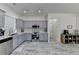 Updated kitchen featuring gray cabinets, stainless steel appliances, white countertops, and a decorative backsplash at 2157 Staunton Dr, Duluth, GA 30096