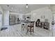 Kitchen with island and stainless steel appliances and white wood patterned flooring at 2157 Staunton Dr, Duluth, GA 30096