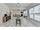 Bright and airy living room featuring a fireplace, stairs, breakfast nook, and lots of natural light at 2157 Staunton Dr, Duluth, GA 30096