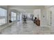 Open concept living room with view of the kitchen and white wood patterned flooring at 2157 Staunton Dr, Duluth, GA 30096