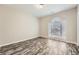 Light-filled bedroom with a view, featuring new floors and neutral walls at 2985 Pilgrim Mill Rd, Cumming, GA 30041