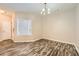 Cozy dining room features hardwood floors and a chandelier, perfect for Gathering meals at 2985 Pilgrim Mill Rd, Cumming, GA 30041