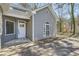 Inviting front entrance with a white door, sidelight window and adjacent arched window at 2985 Pilgrim Mill Rd, Cumming, GA 30041