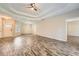 Inviting living room with hardwood floors, a fireplace, and an open layout to the dining area at 2985 Pilgrim Mill Rd, Cumming, GA 30041